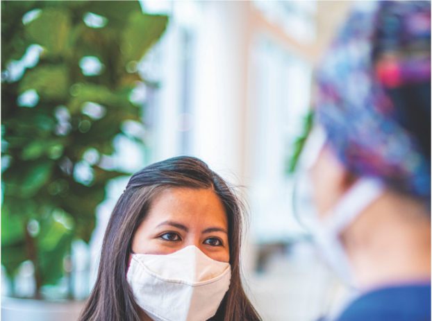 doctor speaking with family member