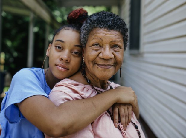 grandaughter hugging grandmother