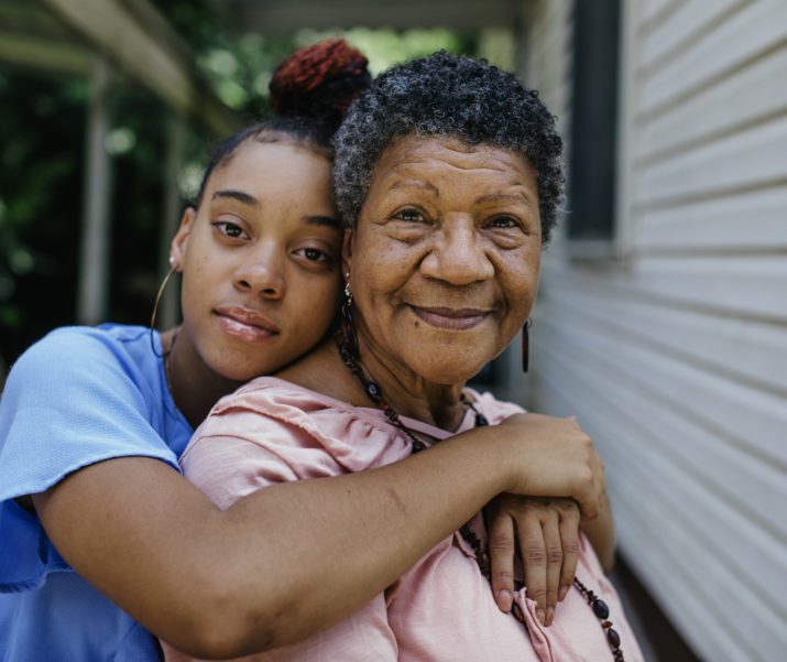 grandaughter hugging grandmother