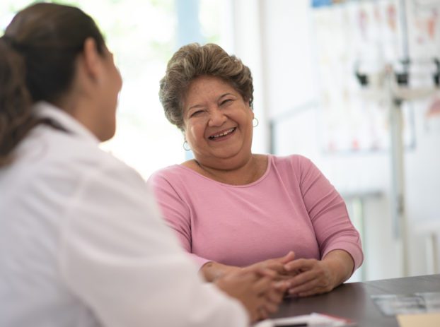 nurse talking to woman