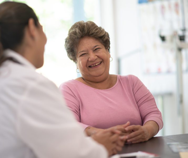 nurse talking to woman